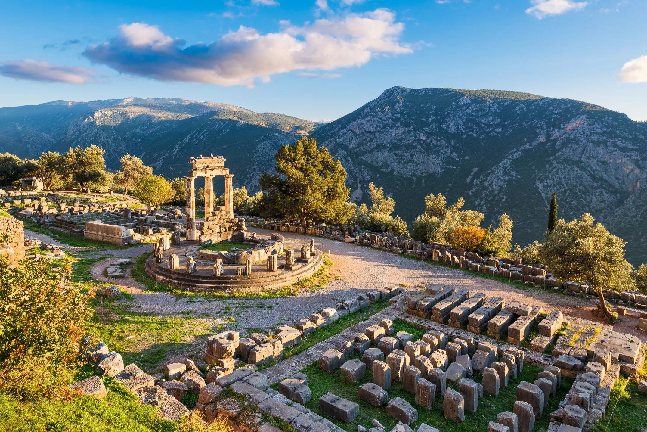 High angle shot of ruins of a temple with mountains in the distance