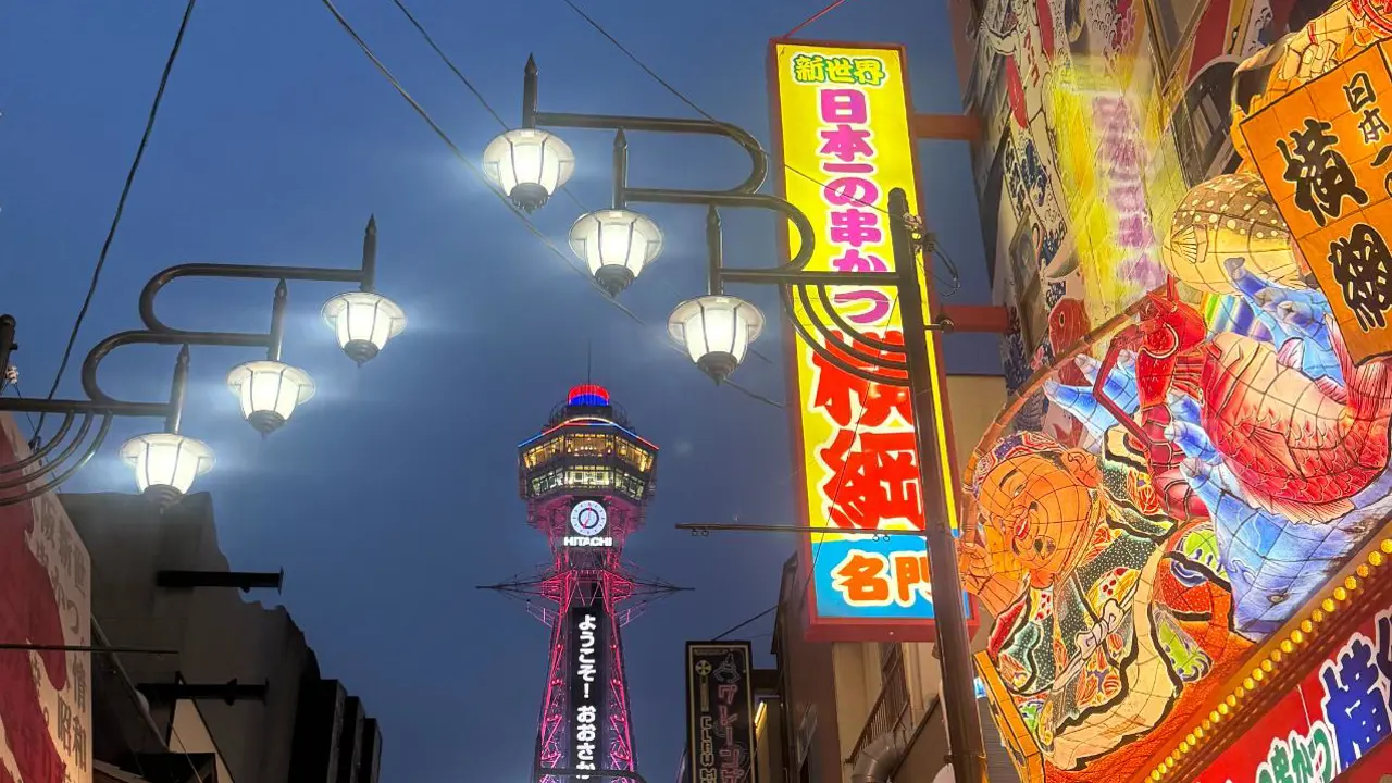 Lively Shinsaibashi shopping street in Osaka, lined with colourful storefronts and illuminated signs