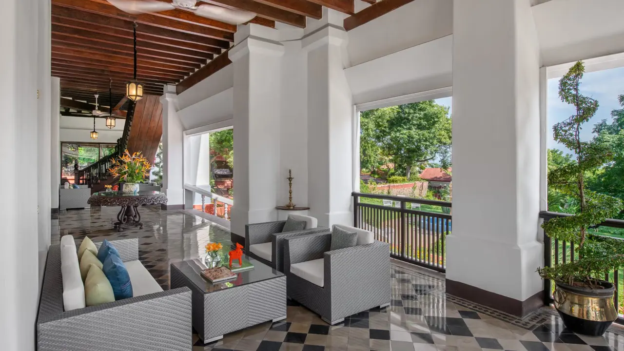 Bright terrace at The Taj Gateway Hotel in Madurai, featuring contemporary seating and lounge spaces, patterned flooring, and views over the courtyard and landscaped gardens