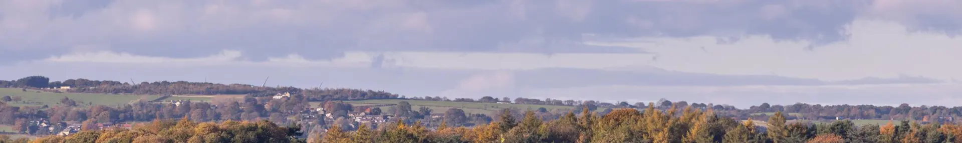 Harewood House, a grand stately home set among autumnal trees and rolling Yorkshire countryside