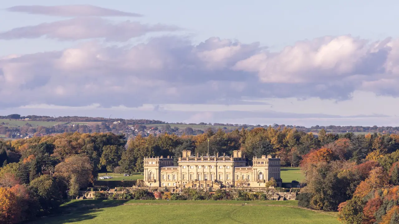 Harewood House, a grand stately home set among autumnal trees and rolling Yorkshire countryside