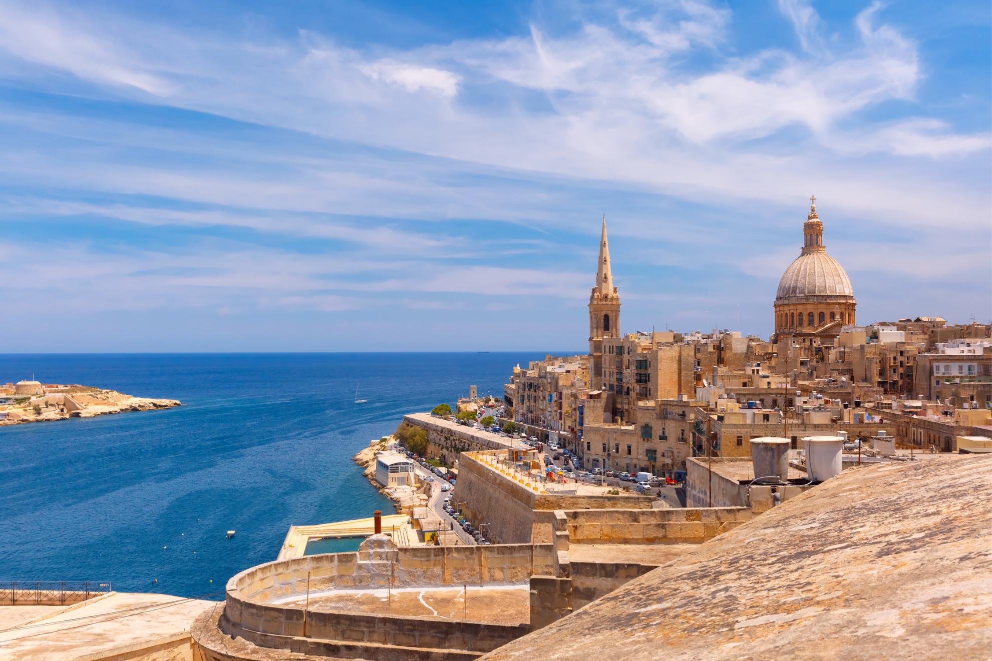 View from above the golden domes of churches and roofs in Valletta, Malta