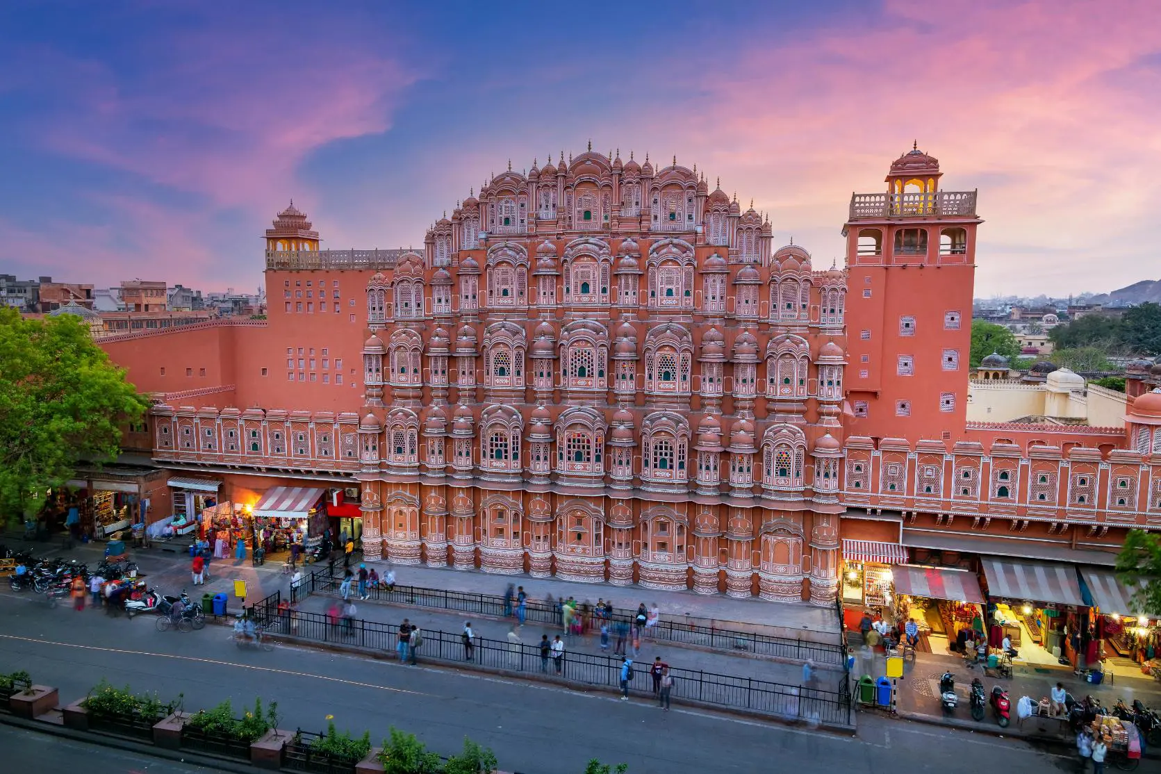 The Hawa Mahal, or Palace of the Winds, in Jaipur’s Pink City, displaying its striking honeycomb façade with hundreds of intricately carved windows at sunset