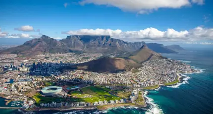 Aerial view of Cape Town with Table Mountain and the coastline in the background