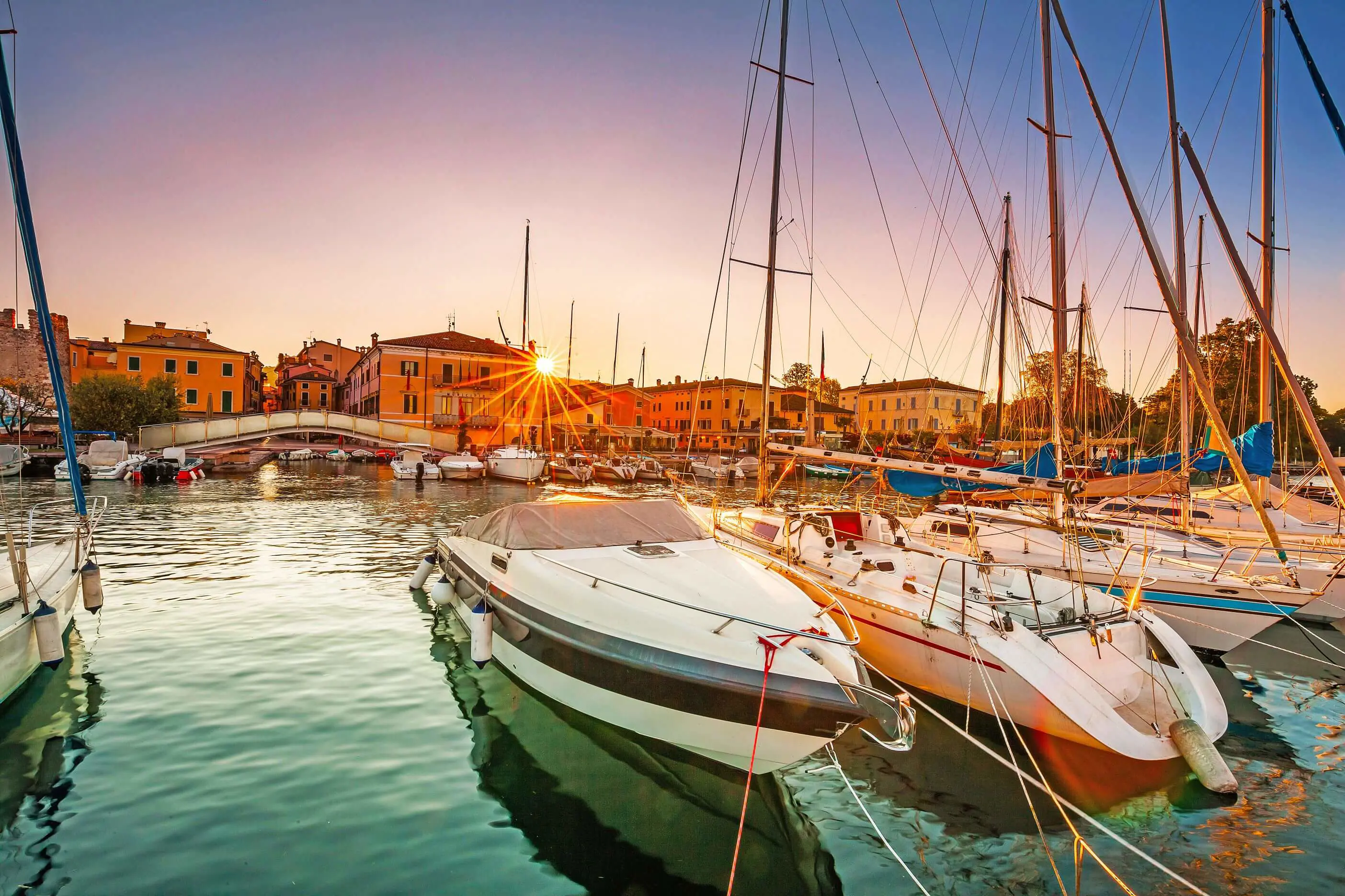 Bardolino Harbour, Lake Garda, Italy, with boats on the water 