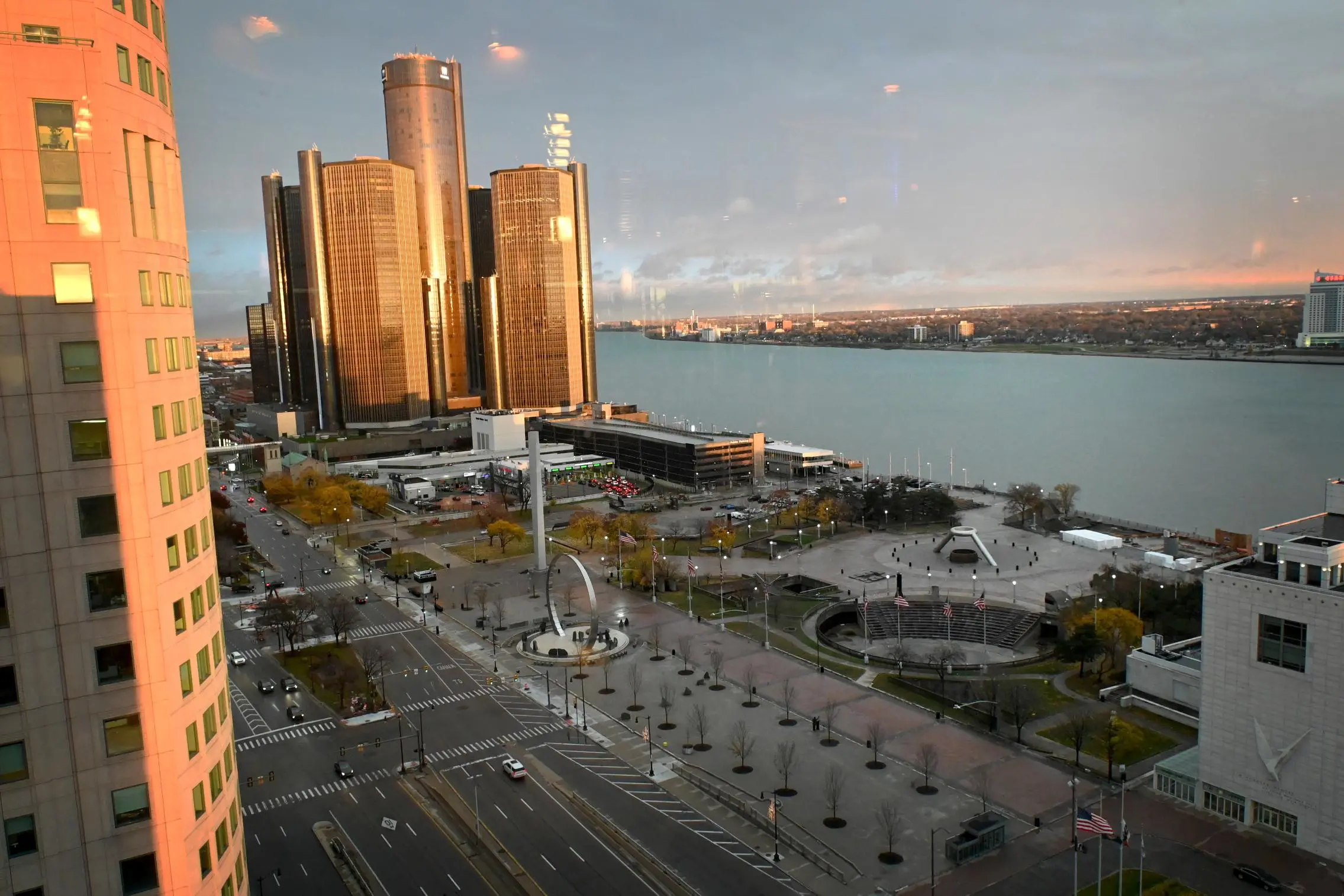 View from Fort Pontchartrain hotel, overlooking downtown Detroit with the GM Renaissance Center, Hart Plaza, and the Detroit River, with Windsor, Canada visible across the water