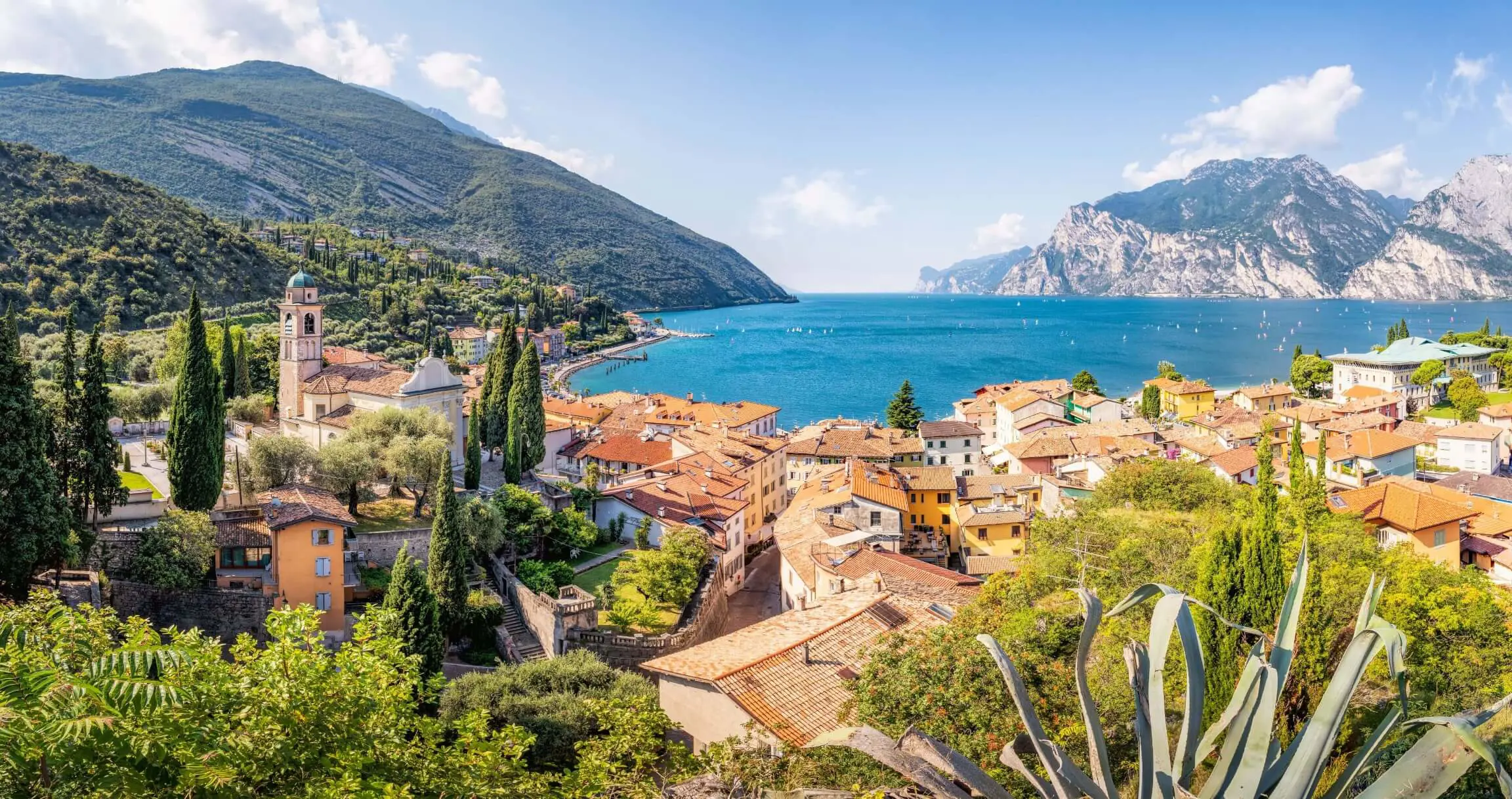 View of water from Torbole, Lake Garda with buildings in forefront