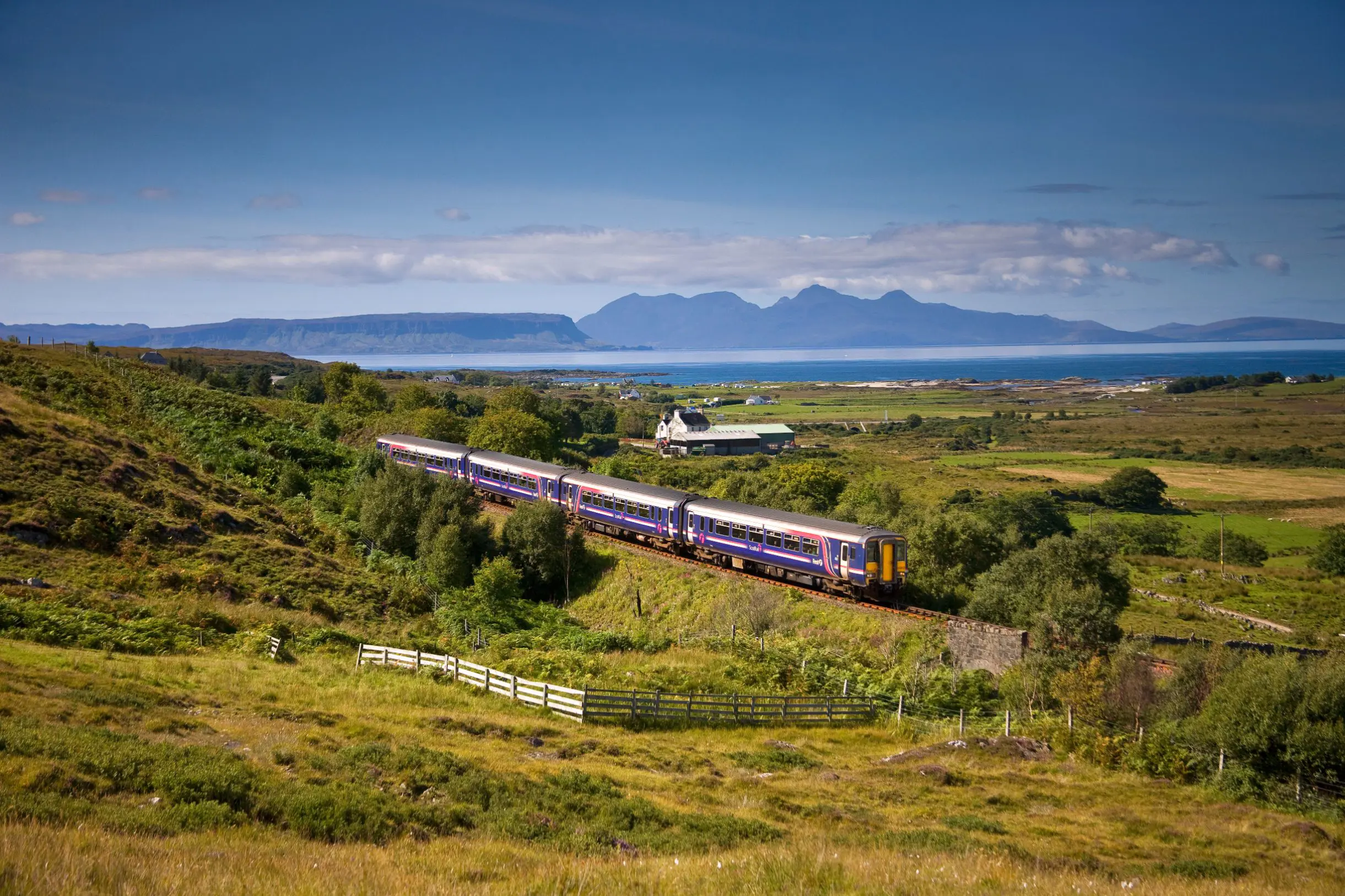 A Sprinter Mallaig Line train going along the railway in the Scottish Highlands