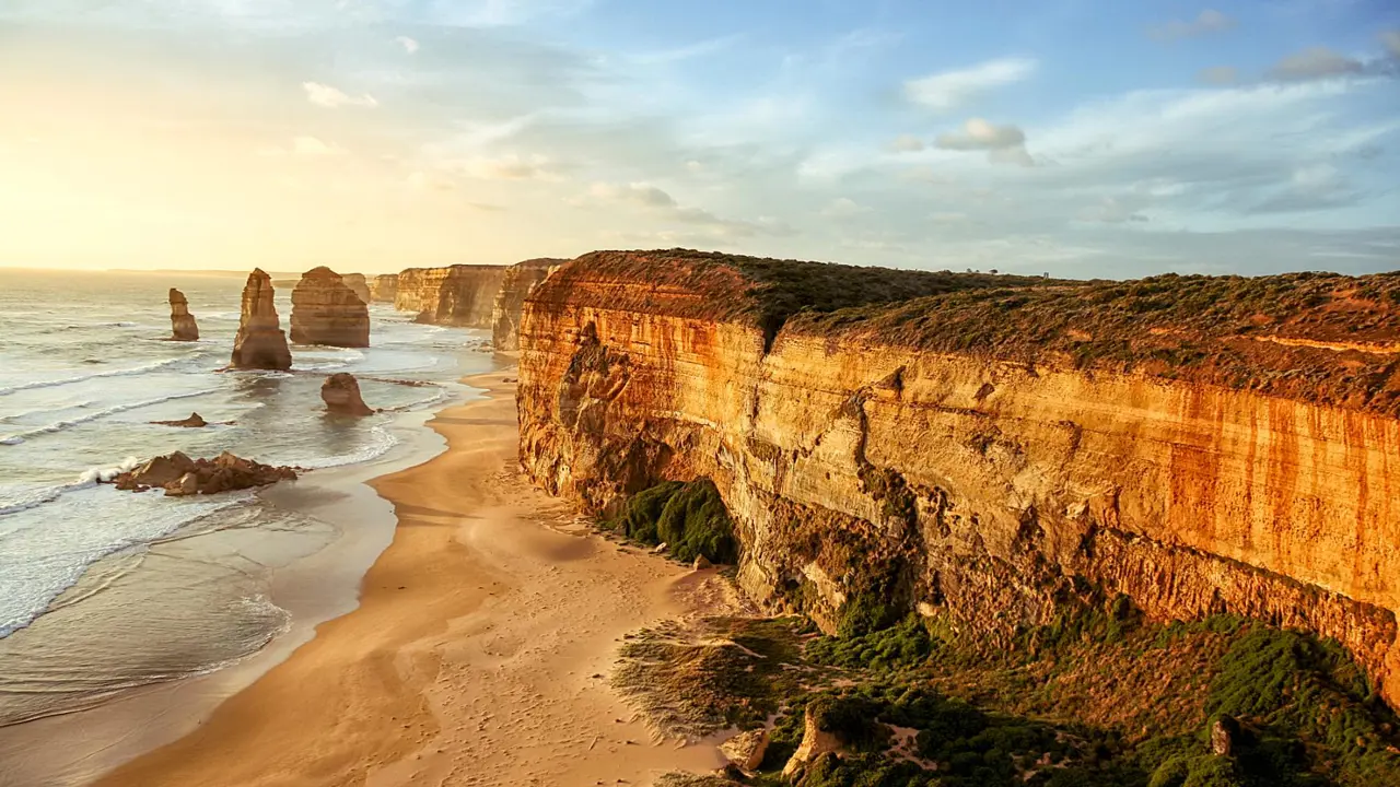 Limestone stacks known as the Twelve Apostles rising from the ocean along the Great Ocean Road in Victoria, Australia.