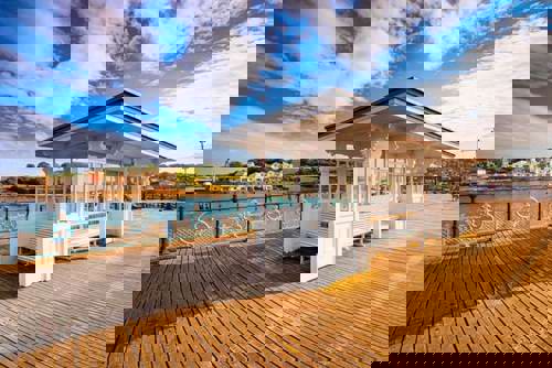 Golden light drenches the classic pier of Swanage, Dorset.