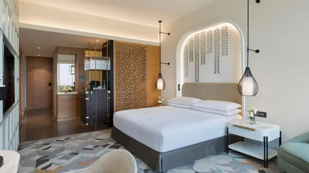 A stylish double room at the InterContinental Jaipur with warm décor and soft ambient lighting