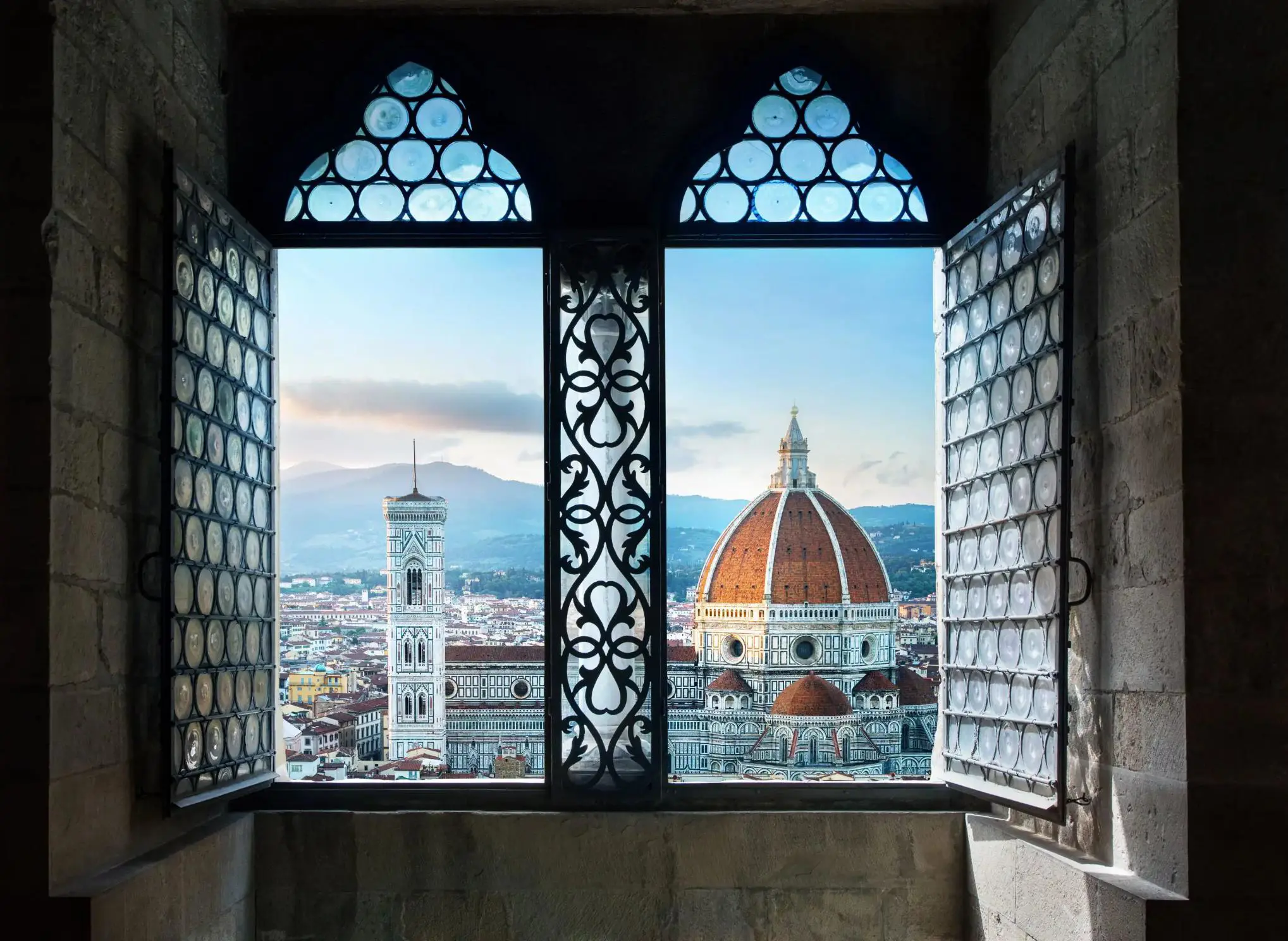 Florence cityscape through a window, showing the Cathedral of Santa Maria del Fiore
