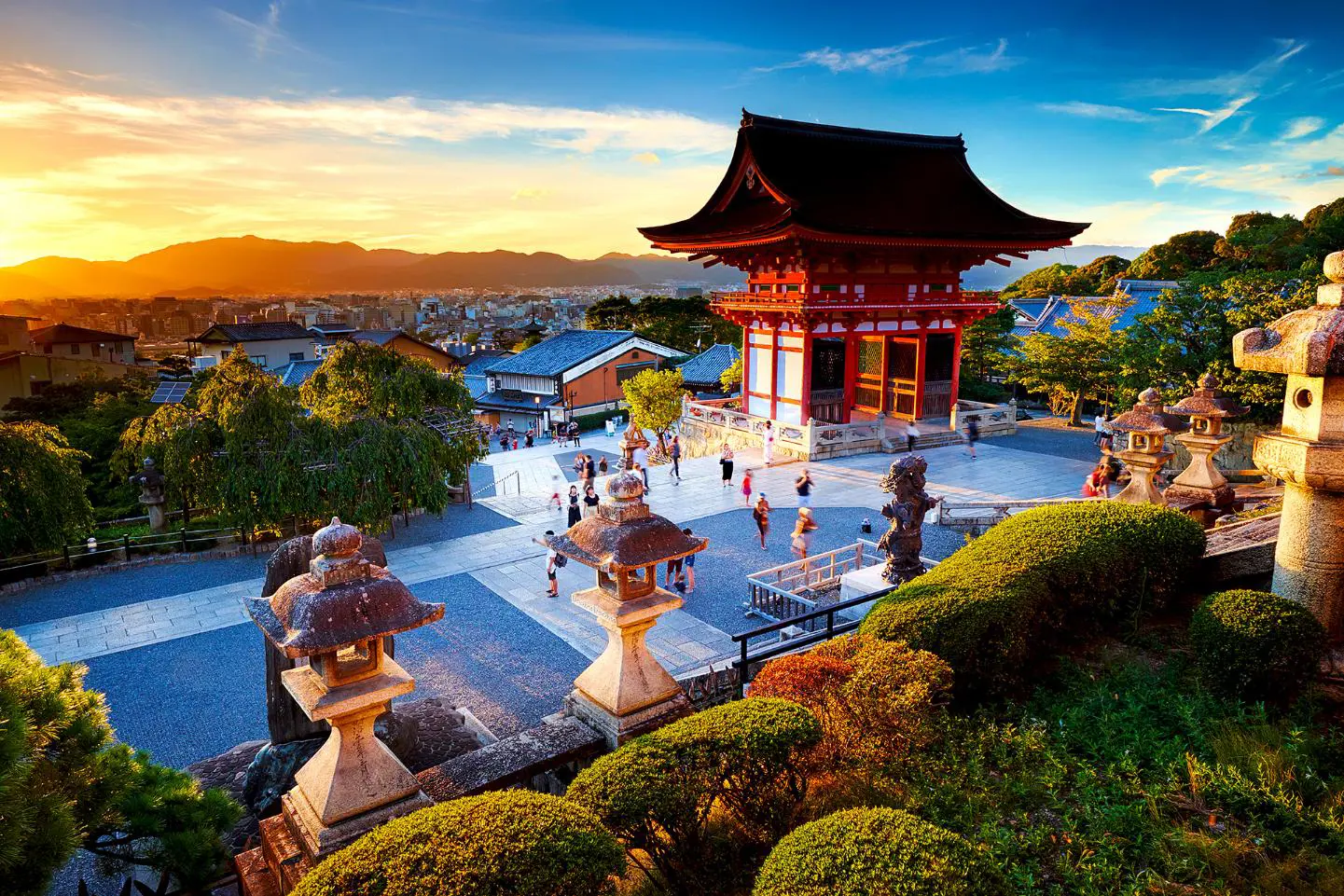 Kiyomizu-dera Temple in Kyoto perched on a hillside, with wooden terraces overlooking colourful autumn foliage