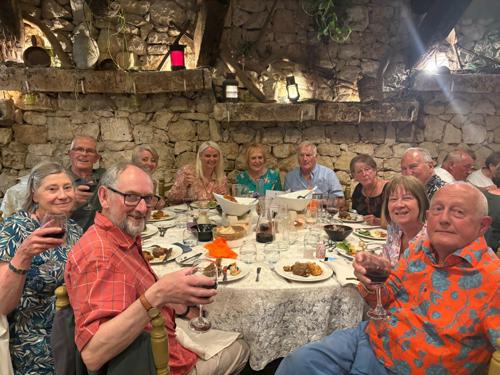 A tour group enjoying a traditional Maltese dinner in Malta