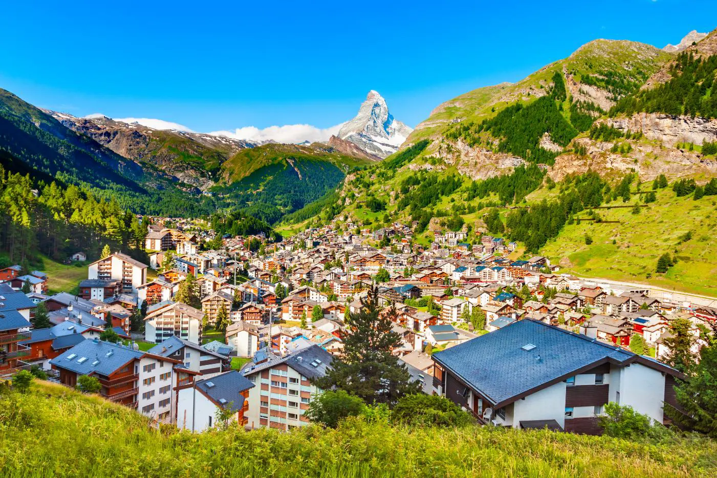 View of Zermatt, Switzerland, showing the town’s buildings in the valley below with the Matterhorn towering in the distance