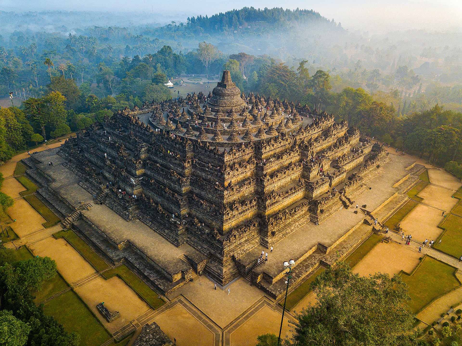 Borobudur Temple at sunrise, showing stone stupas and terraces of the world’s largest Buddhist temple near Yogyakarta