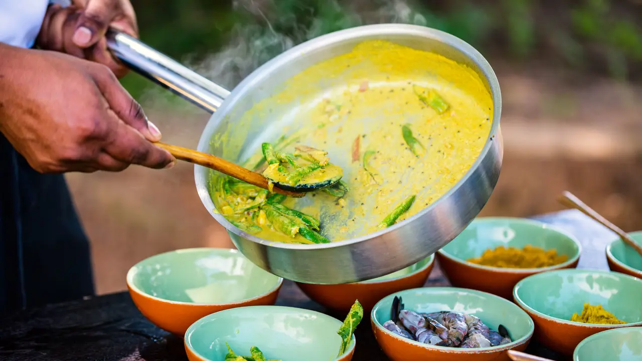 Chef preparing traditional Sri Lankan curry