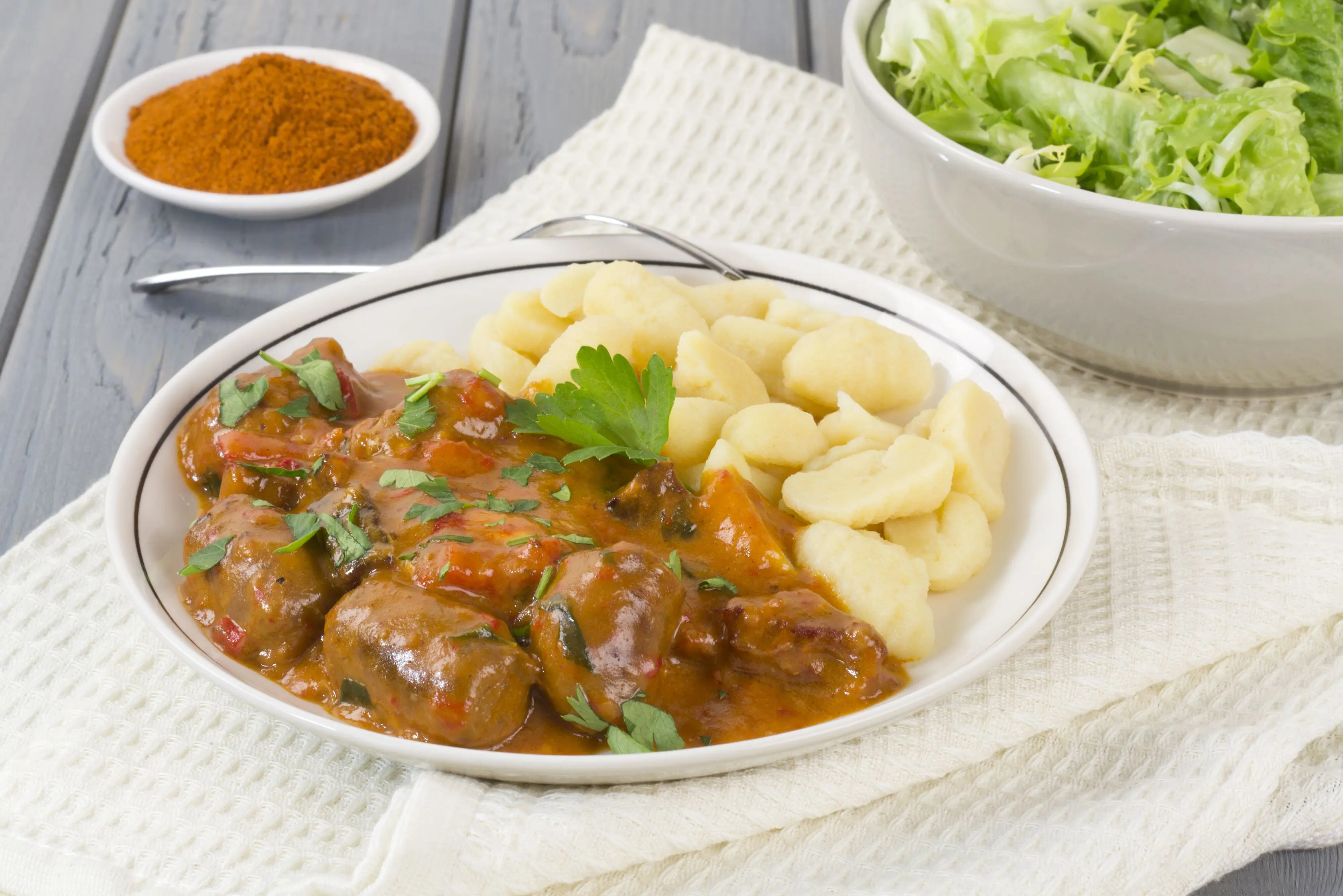 Plate of Pörkölt, a beef an onion stew, with nokedli (dumplings)