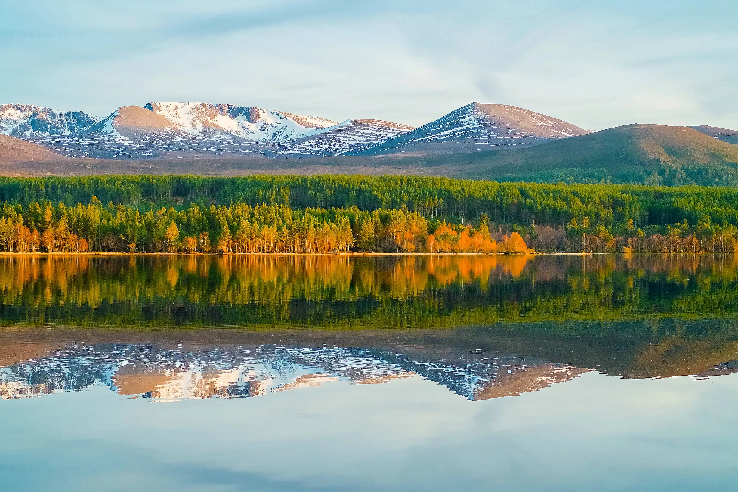 View of Cairngorm Mountains with a loch in the forefront 