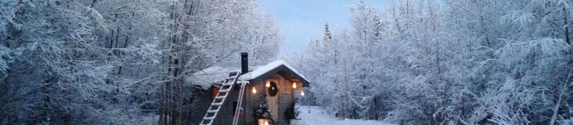 A cabin in the snowy woods in Pajala, Lapland 