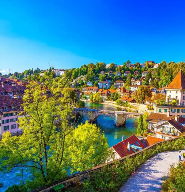 Panoramic view Bern, Switzerland, featuring the historic old town with its medieval buildings and the Aare River flowing through the city