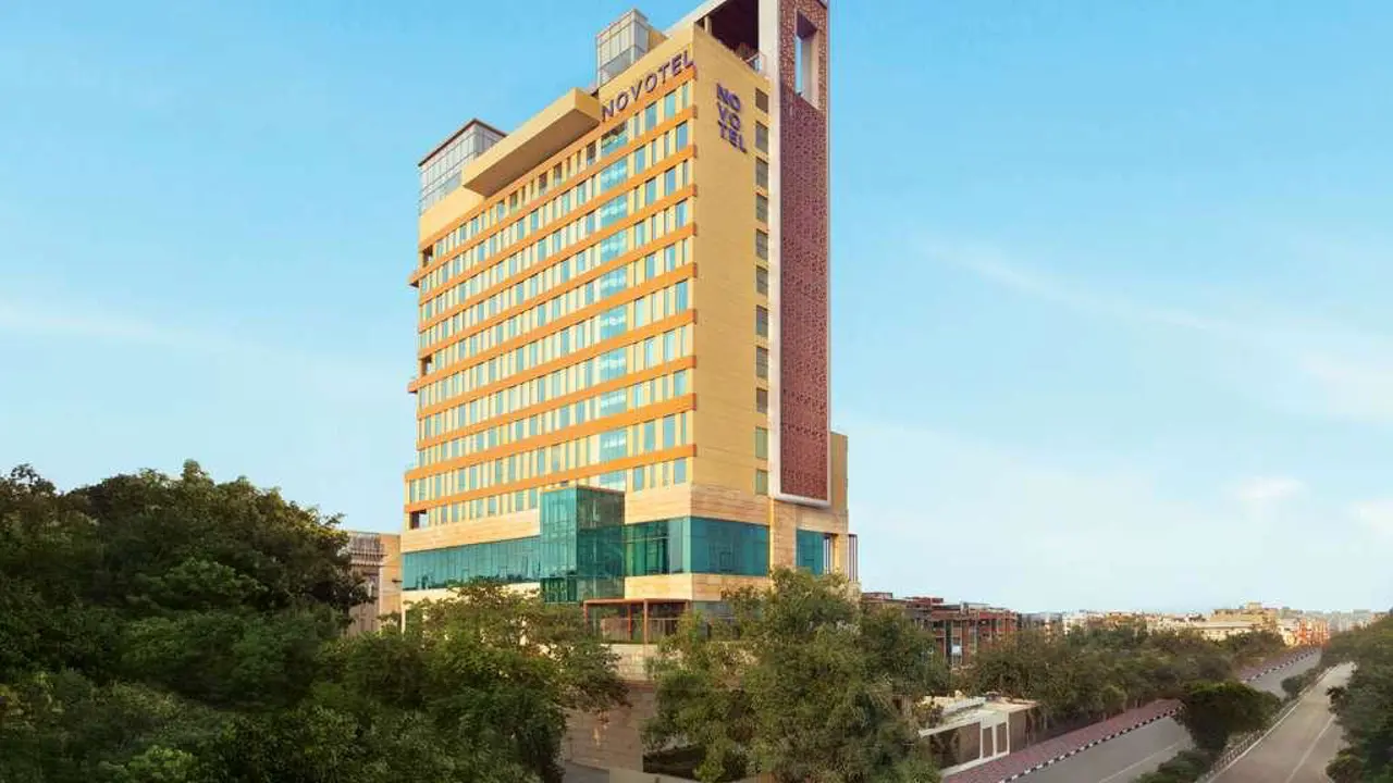 The exterior of Novotel New Delhi City Centre, a tall contemporary building with large windows