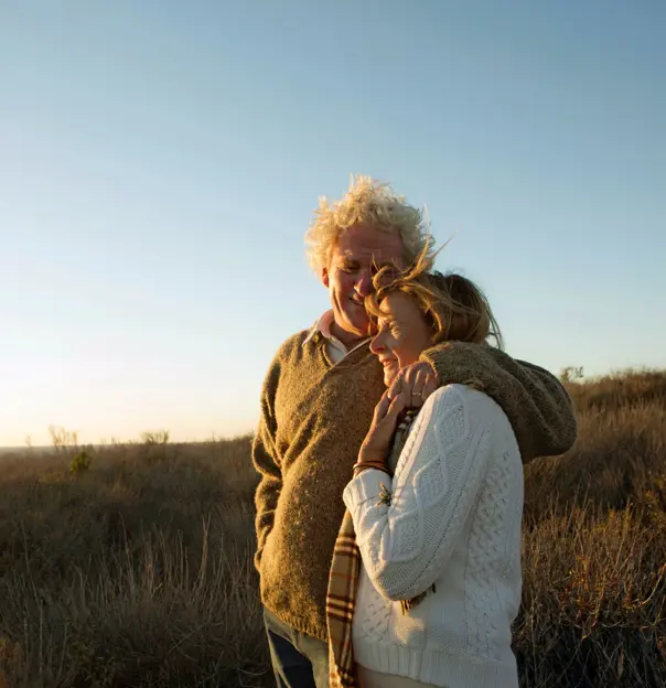 Mature couple smiling looking at the view in the Highlands