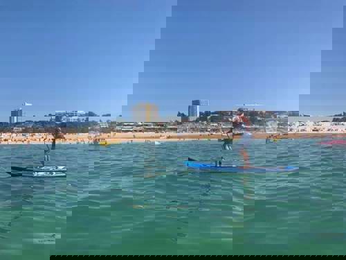 Niel paddleboarding along the sunny shores of the Algarve.