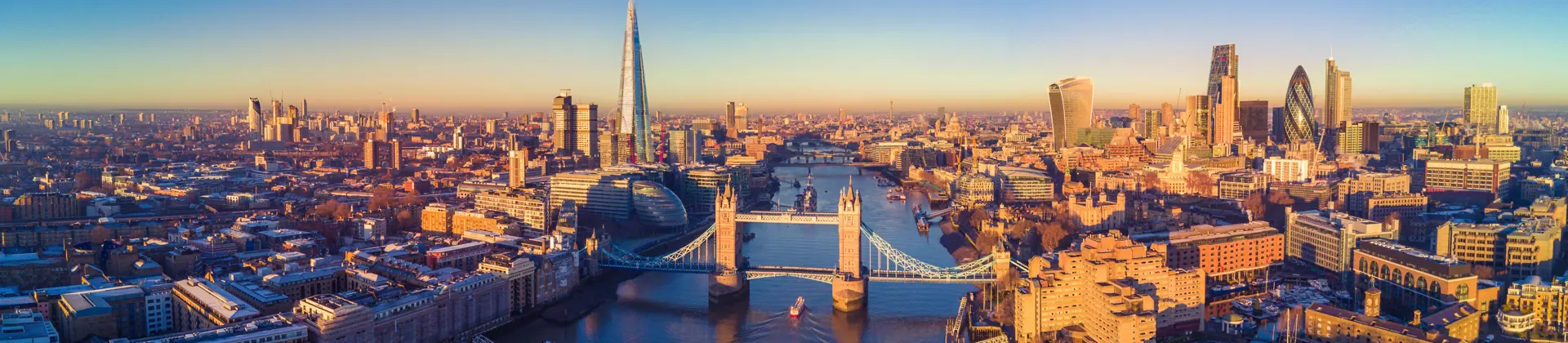 View of the London skyline at sunrise, showing the city's skyscrapers