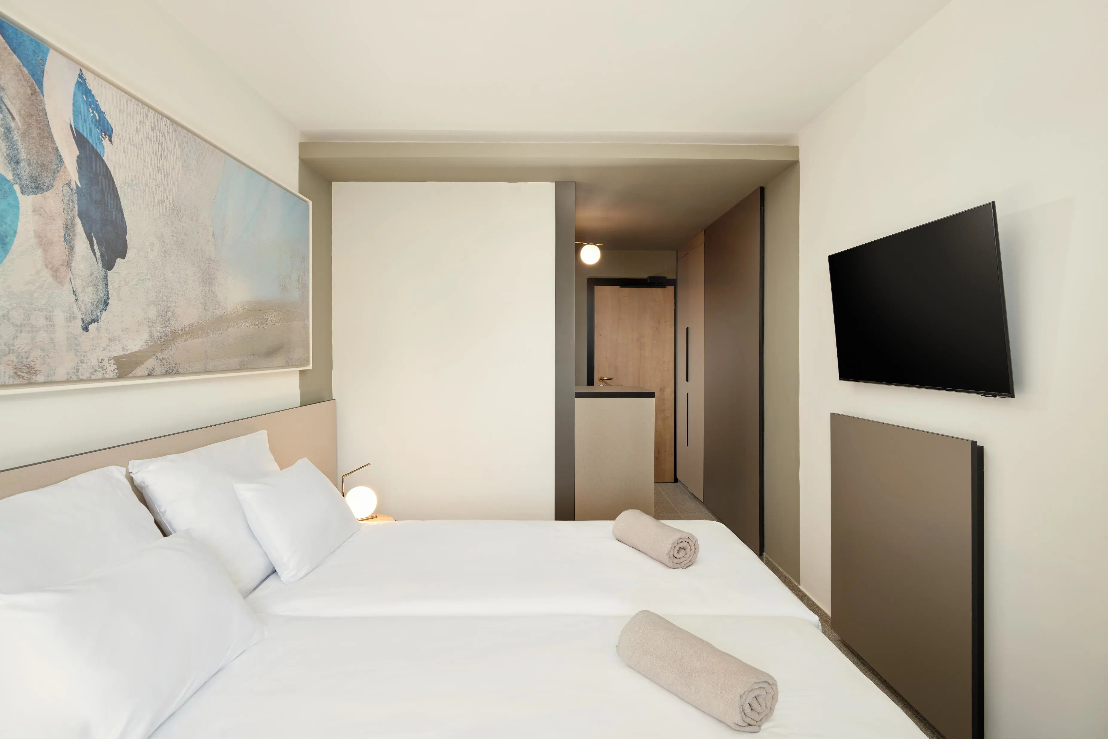 View towards the bathroom and entrance door of a standard room at Hotel Horizont, Baška Voda