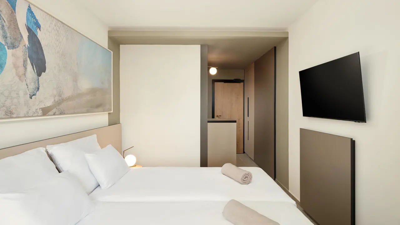 View towards the bathroom and entrance door of a standard room at Hotel Horizont, Baška Voda