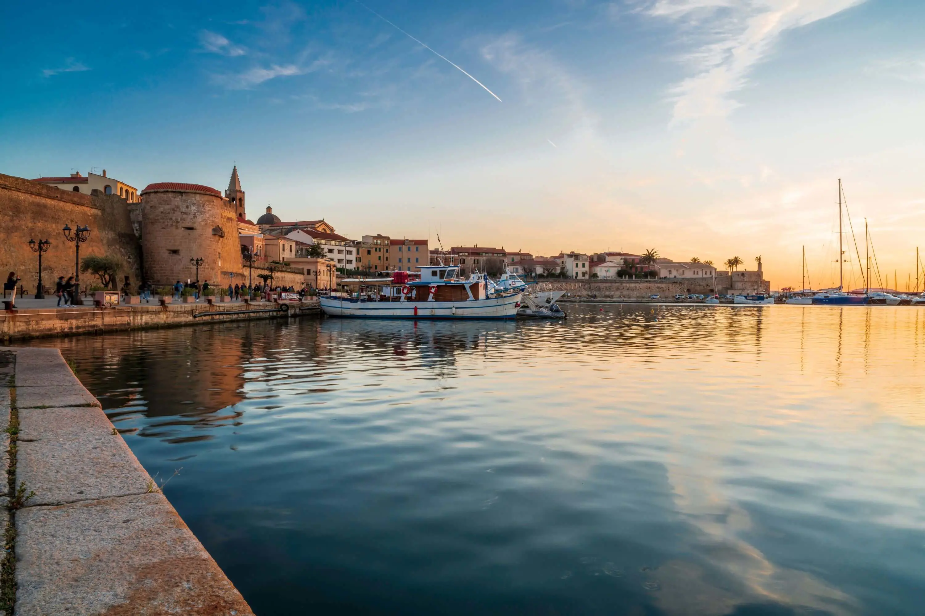 View of Magellano Bastion harbour at sunset, Alghero, Sardinia