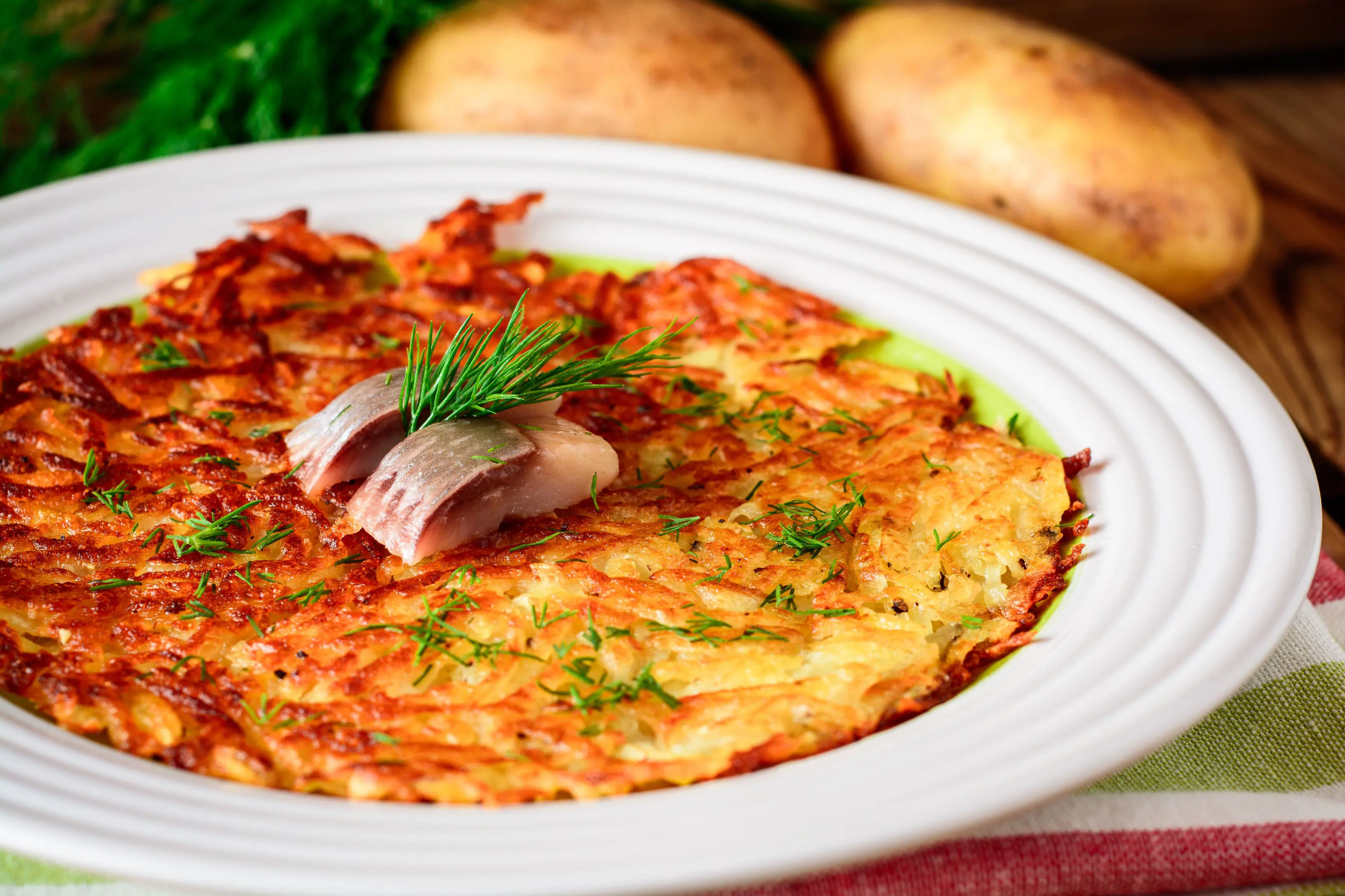 Traditional Swiss Potato Rosti With Dill And Salted Herring