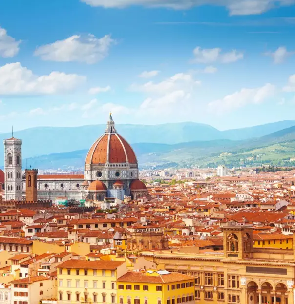 Panoramic view of Florence, Italy, with the Cathedral of Santa Maria del Fiore rising amongst the terracotta rooftops